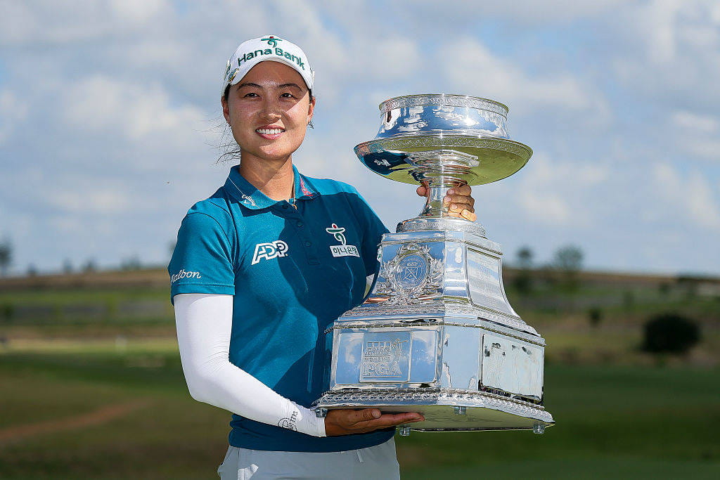 Minjee Lee poses with the trophy after winning the KPMG Women's PGA Championship in 2025